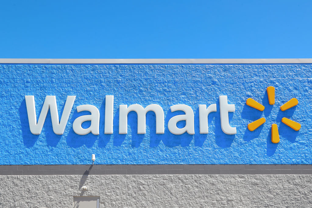 A logo is seen on the outside of a Walmart Supercenter...