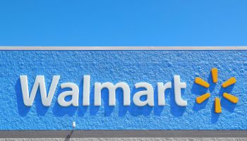 A logo is seen on the outside of a Walmart Supercenter...
