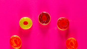 Jelly candies on bright colorful background