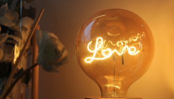 Light bulb decoration with the word love written inside