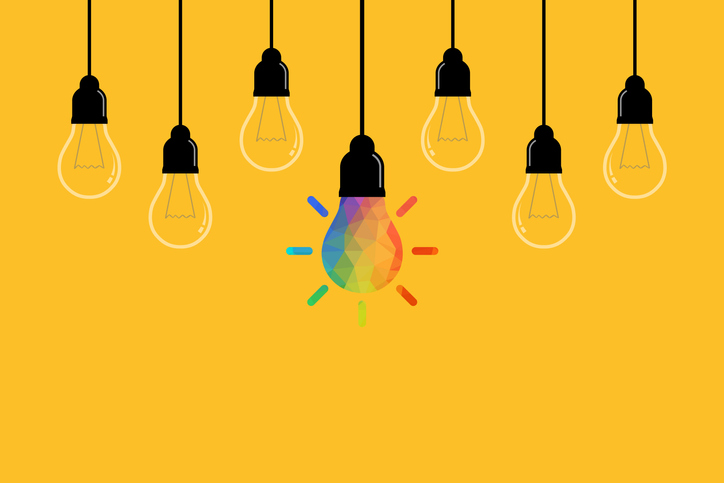 Creative Idea Concepts with Light Bulb on Yellow Background