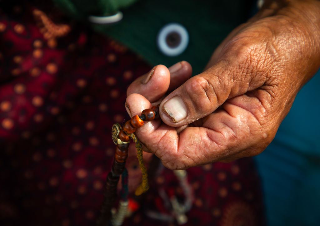 Buddhist hand with a payer beads, Ladakh, Leh, India...